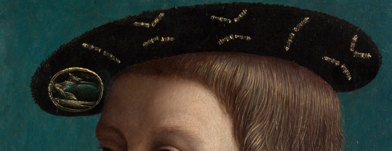 The hat's shape and the scattered gold details add a touch of elegance and visual interest.