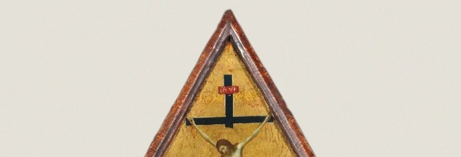 Above the Virgin, a tiny crucifixion shows Christ's future.