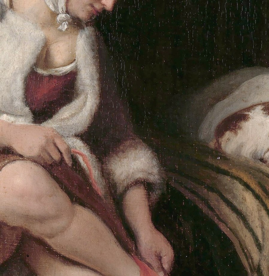 Her robe has luxurious fur trim.