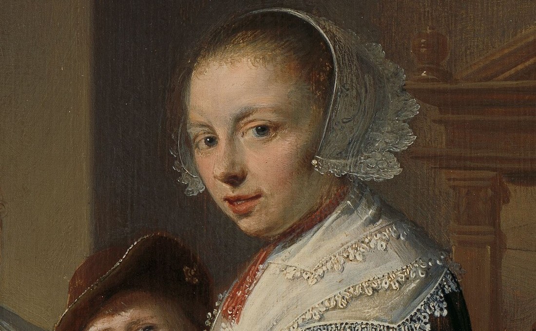 Her delicate lace collar shows her status.