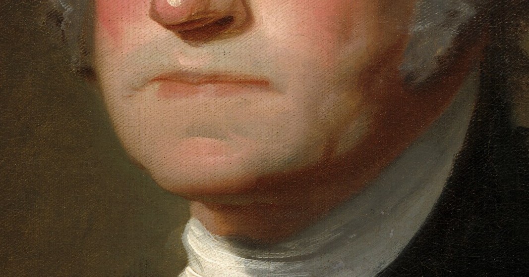 Look closely at his mouth, and the set of his jaw.