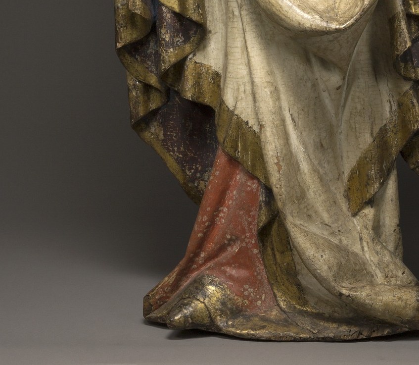 The white robe is virginity. The red hem beneath it?