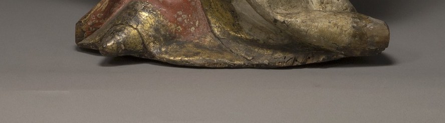 A painted sculpture, standing in silent devotion since 1420.
