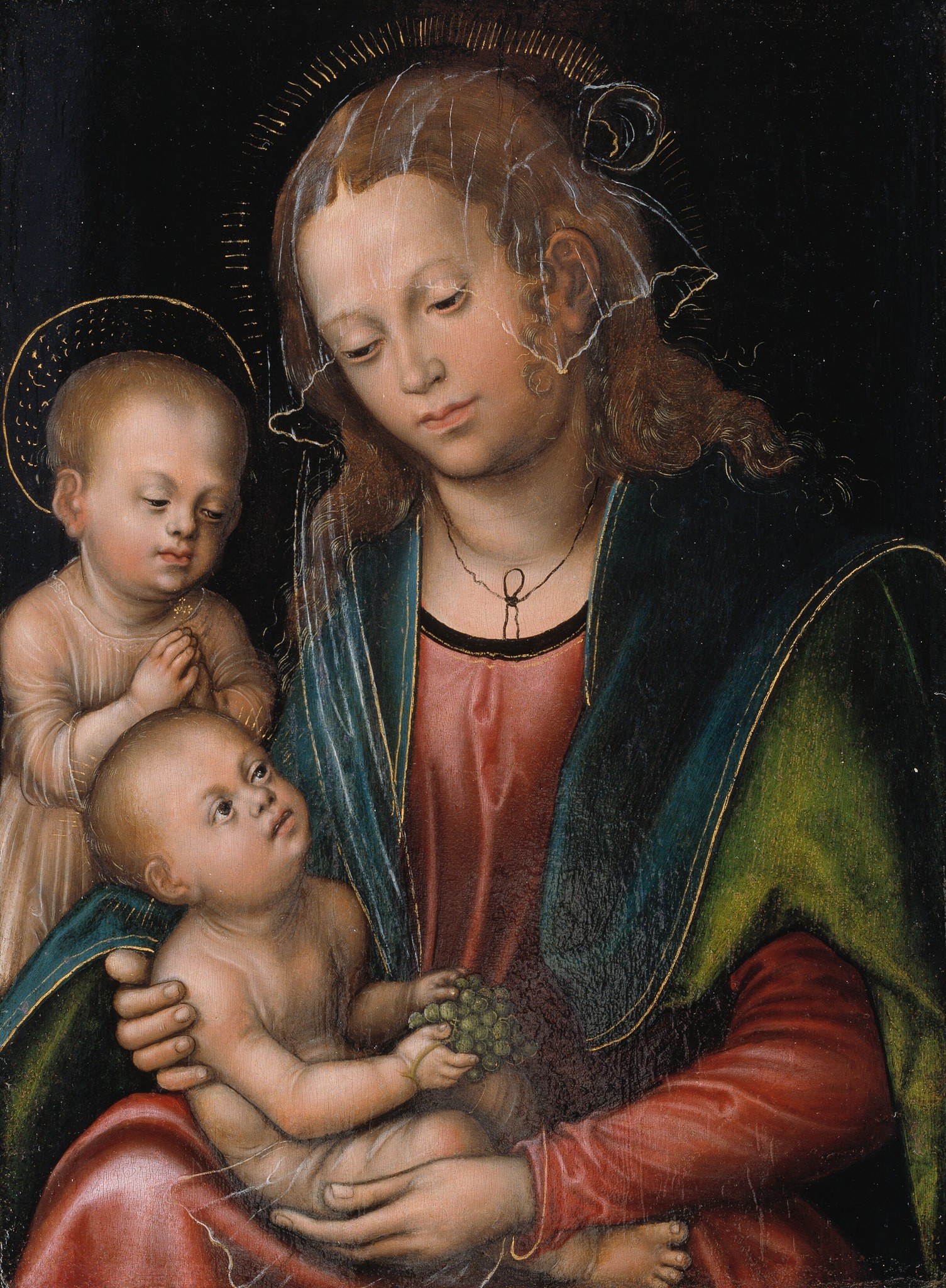 The deep darkness isolates the figures, intensifying their spiritual presence and the intimacy of the scene.