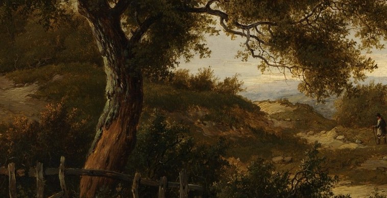 A lone figure walks the winding pathway.
