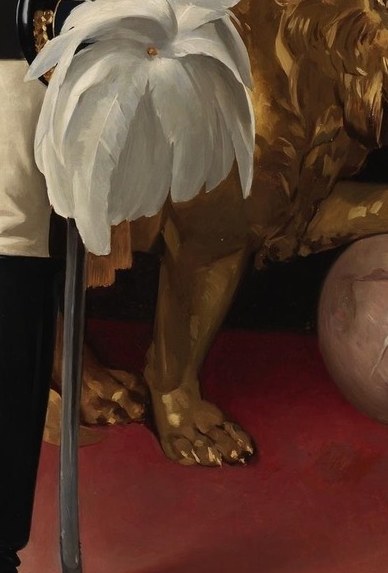 A gilded lion sculpture reinforces his royal power.