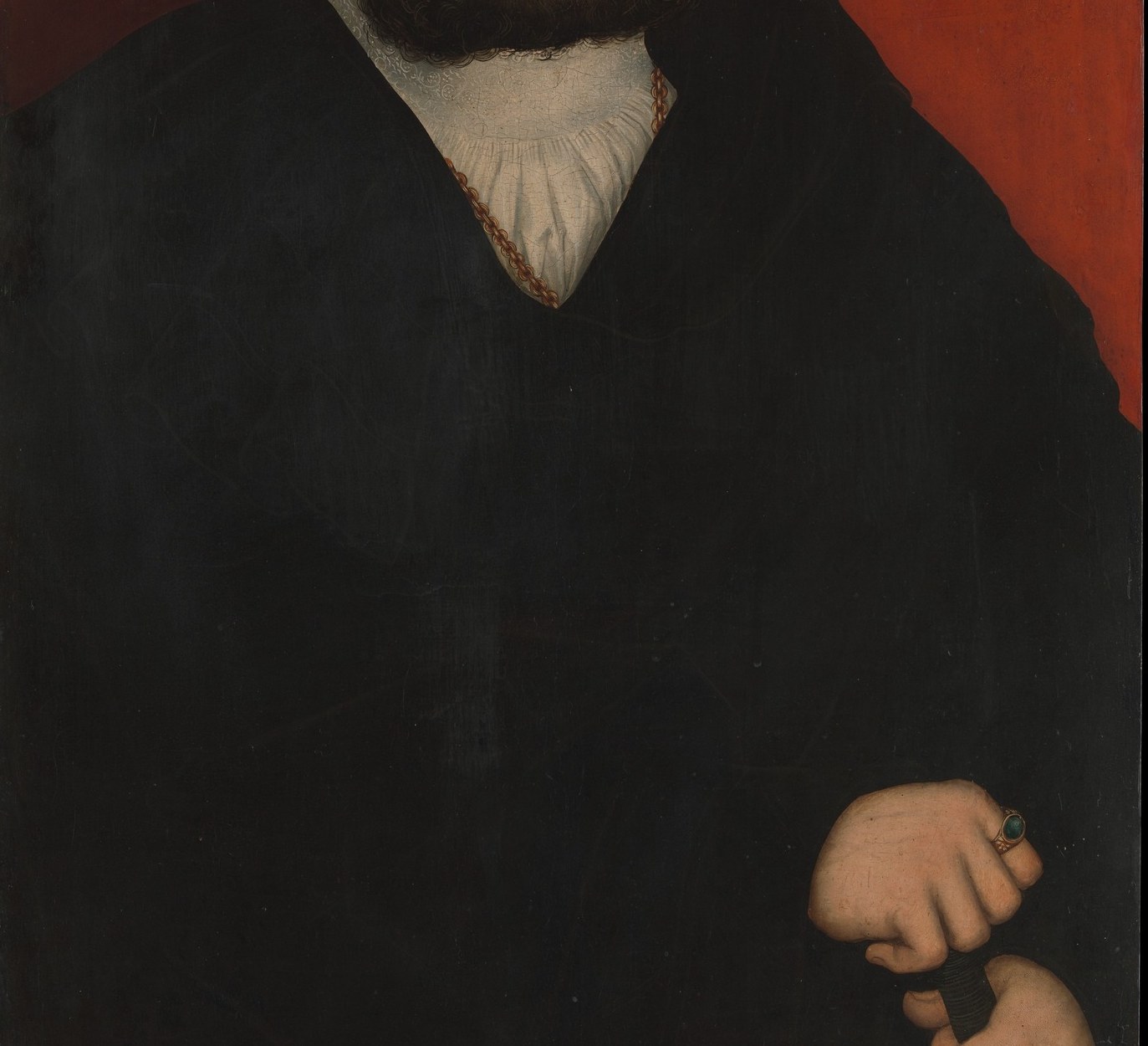 The enveloping black robe dominates the lower two-thirds of the composition; its deep, uniform tone is offset by subtle fur or fabric texture suggesting luxury without ostentation