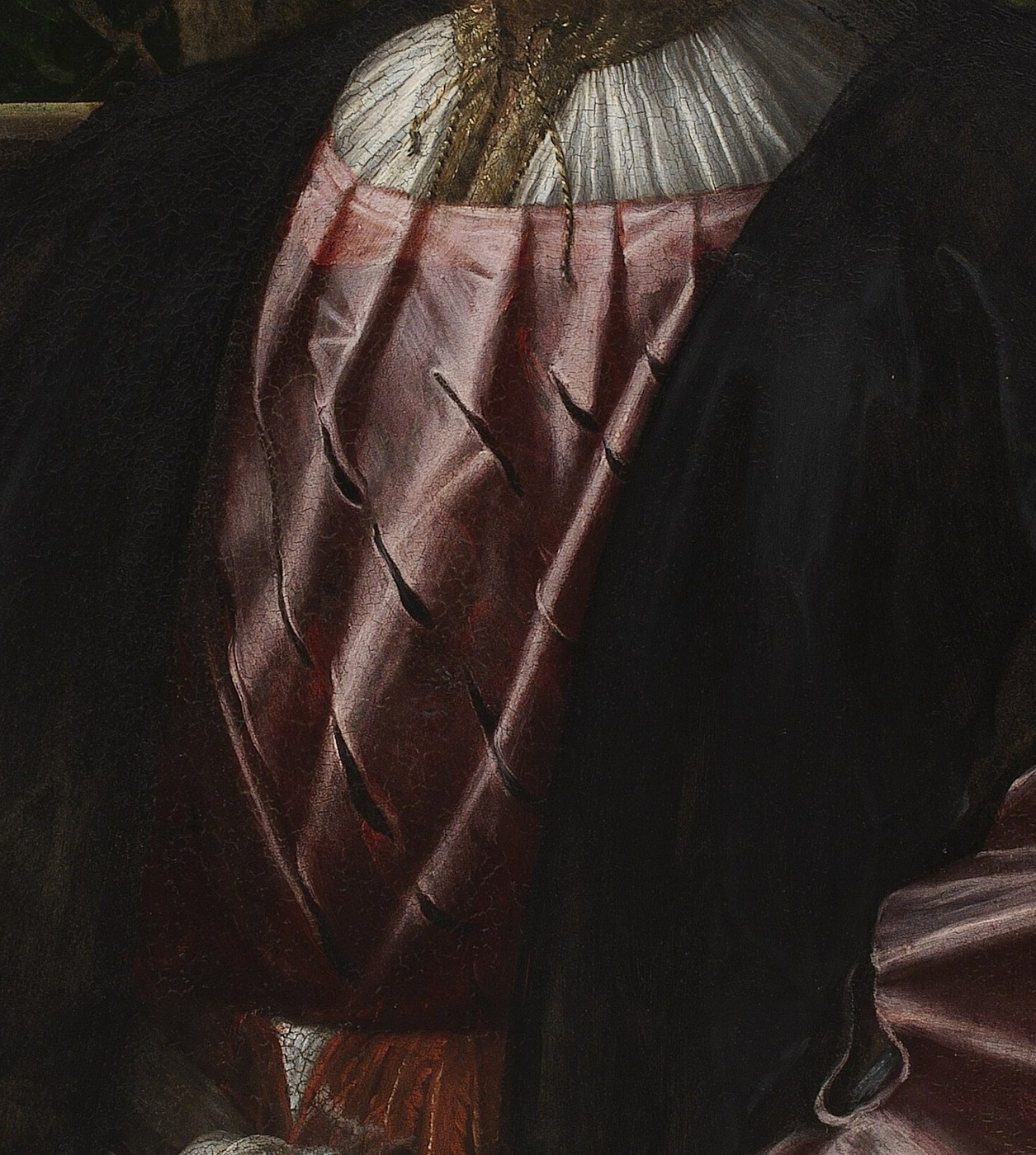 His pink sash flows with a completely different softness.