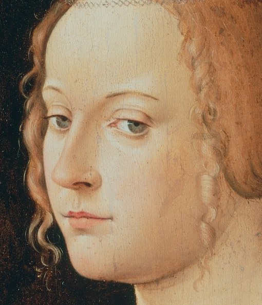 Her serene expression and direct gaze convey a sense of inner peace and devotion.