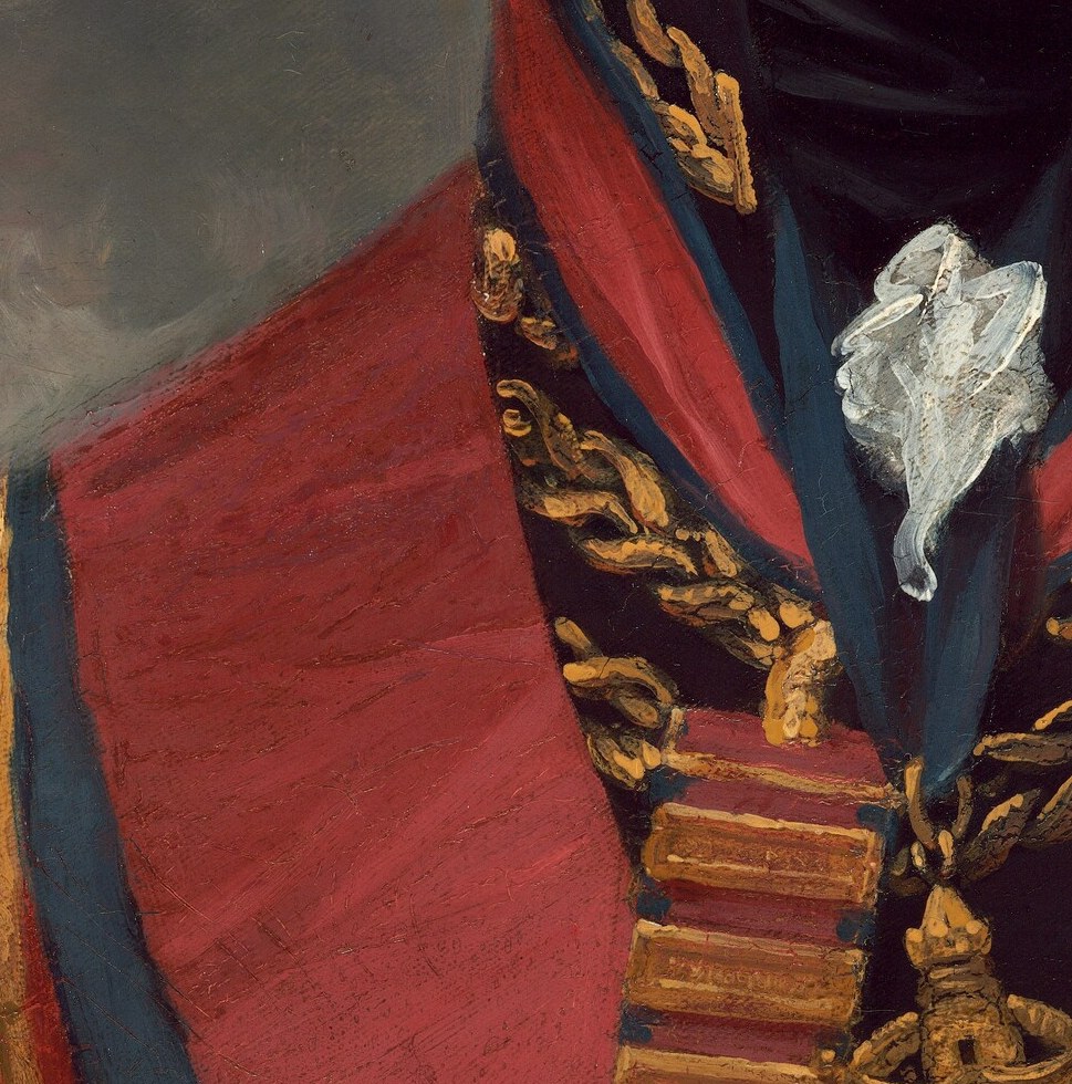 Likely the Order of the Bath star , identifying it decodes Picton's specific honours and connects the painting to the Peninsular War campaign.