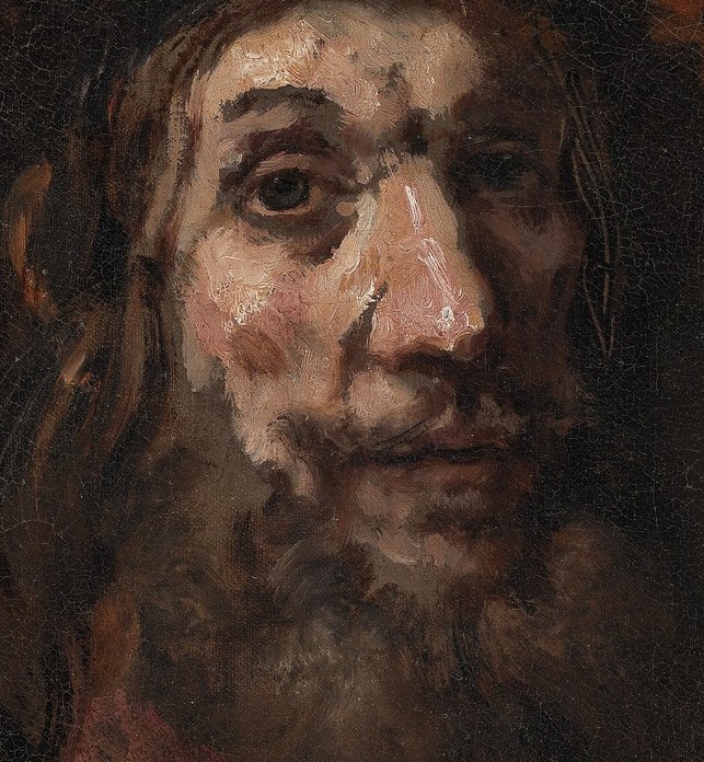 The light carves his weary face.