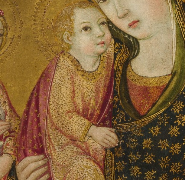 And her hands tenderly hold the infant, a mother's embrace.