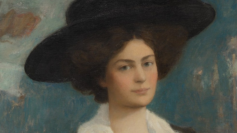 Her heavy coat and feathered hat suggest elegance, even in the cold.