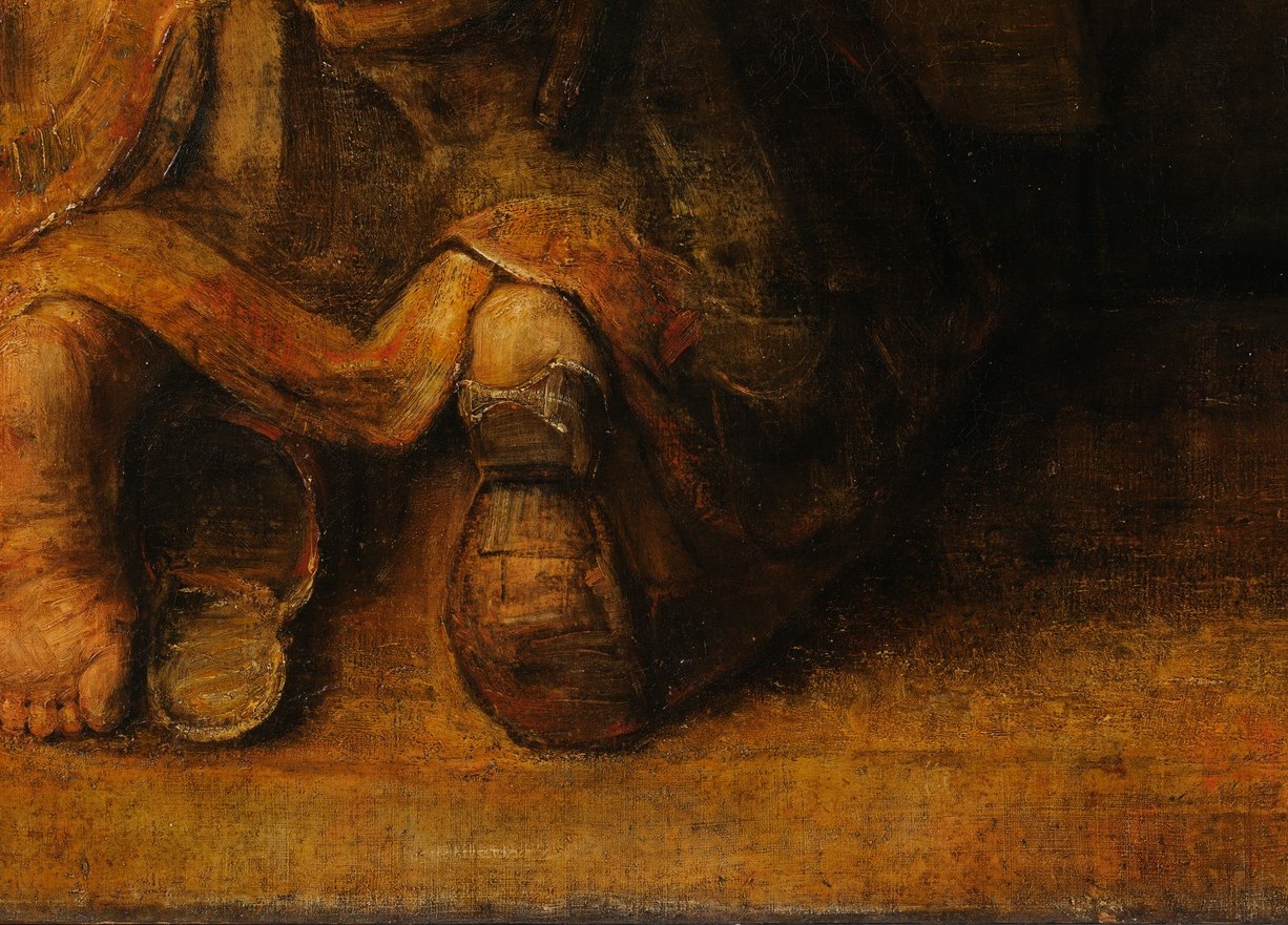 Now look at the son's worn sandal and bare foot.
