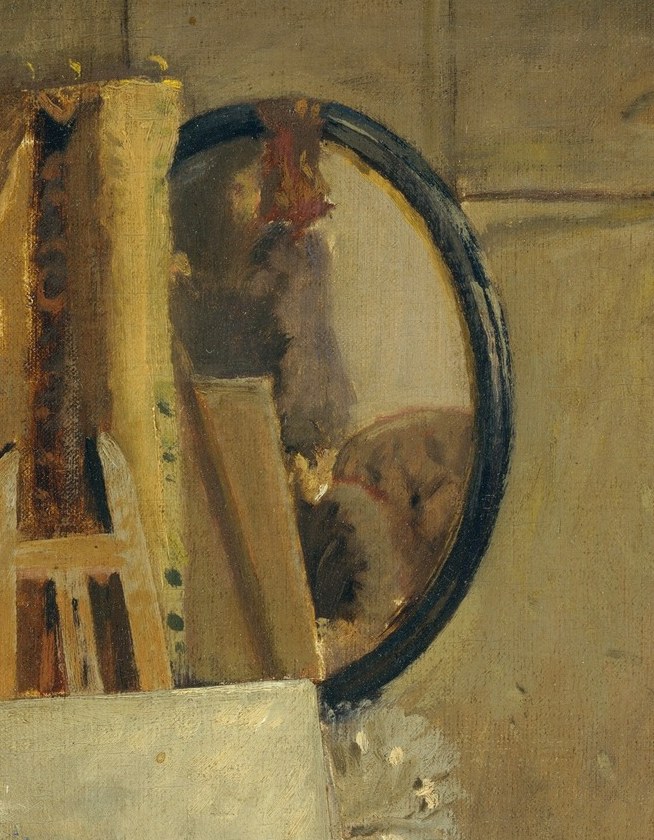 Look closely at the mirror on the wall.