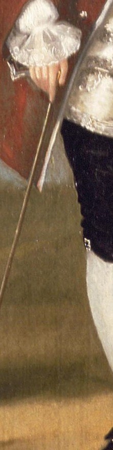 He holds a cane, a symbol of his authority and status.