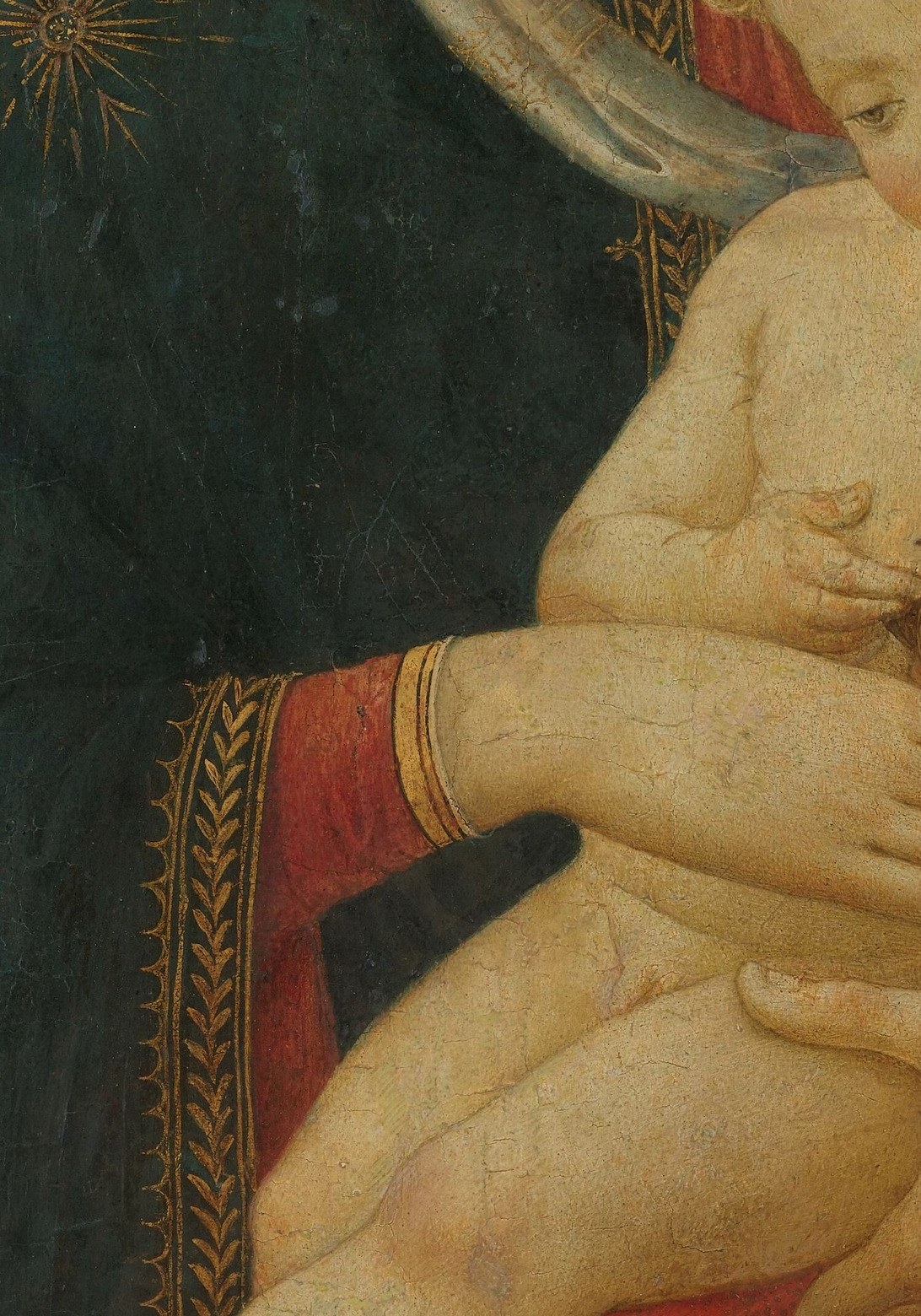 She holds him like a precious jewel.