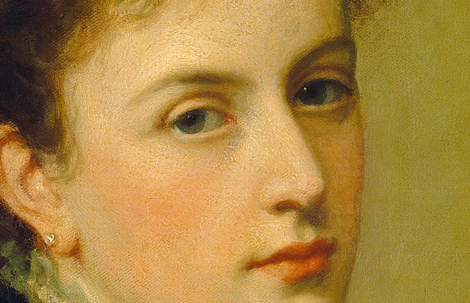 Yet her mouth holds a trace of withheld feeling.