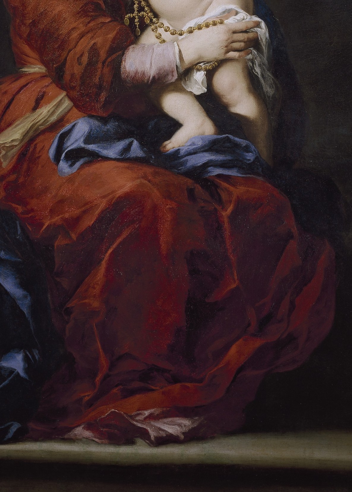 Her red robe means warmth and grandeur.