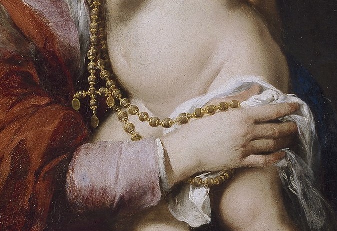 The rosary suggests devout prayer.