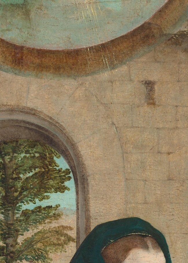 Mary gazes downward, contemplating the scene.