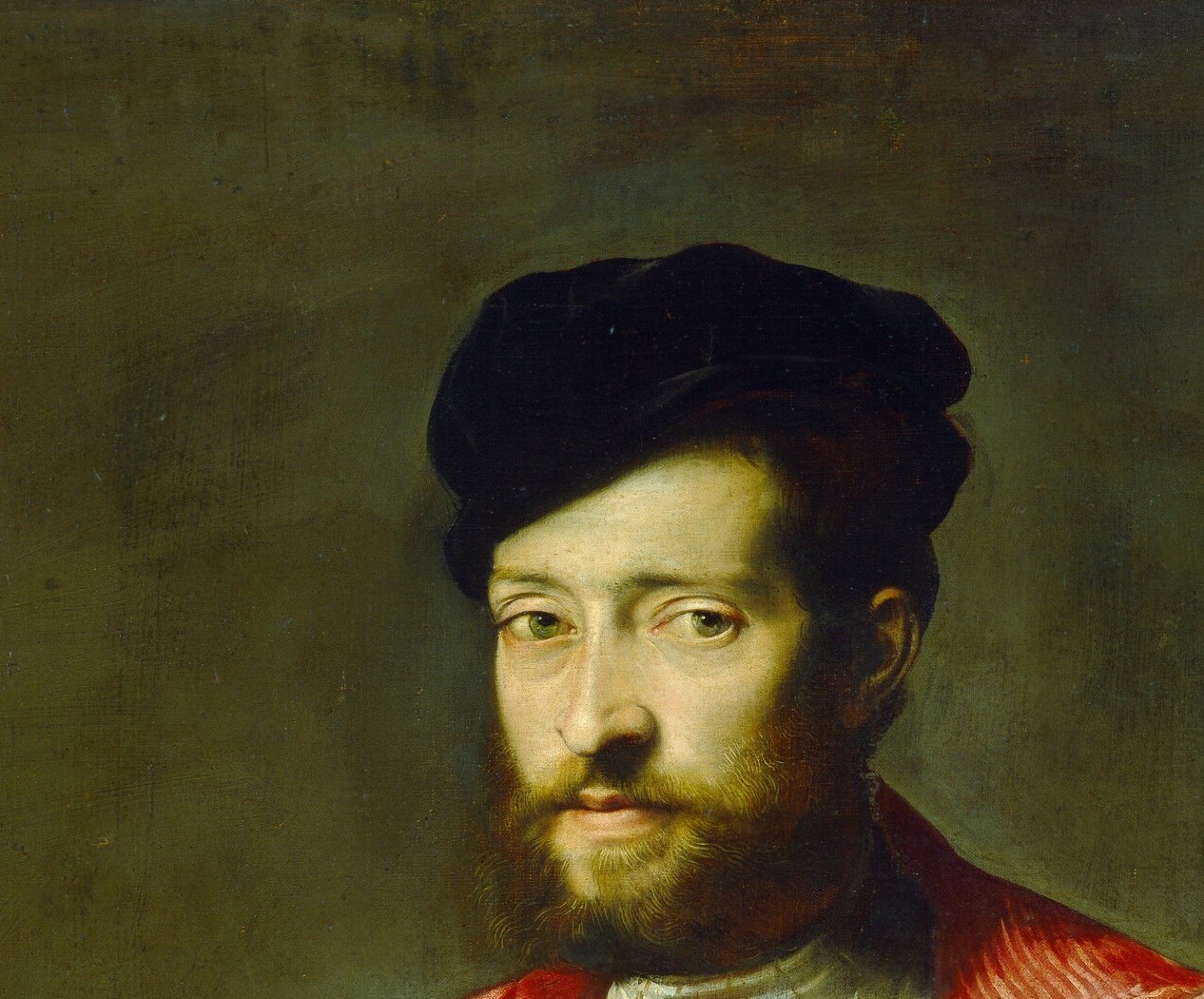 The sitter commands the room in slashed crimson.