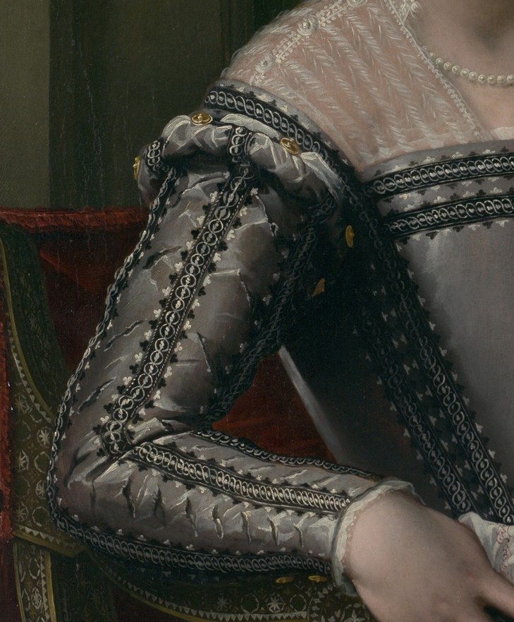 Counterpart to the right sleeve; together they frame the bodice and demonstrate the symmetrical opulence fashionable in the Medici court circa 1600