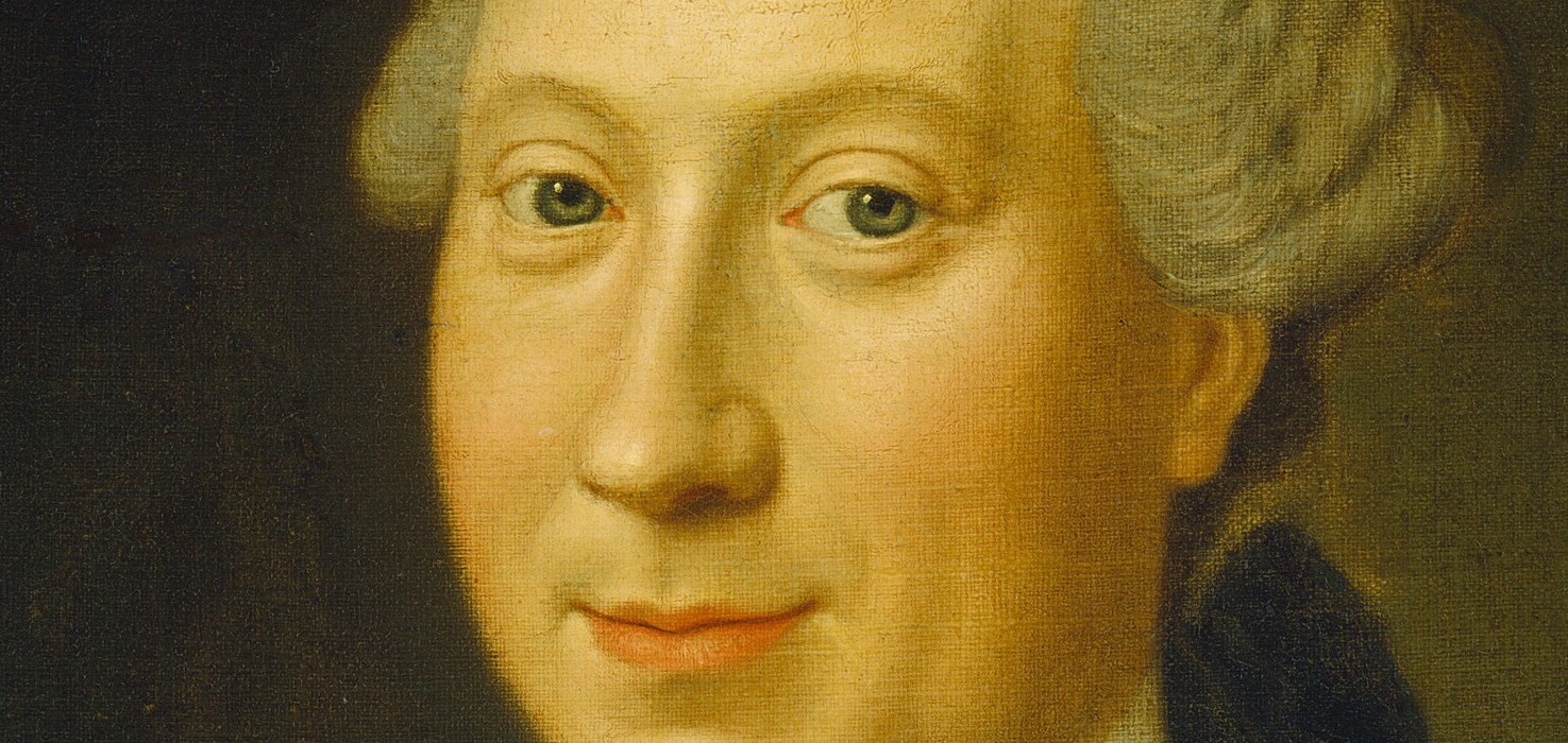 But his eyes hold a quiet, searching gaze.