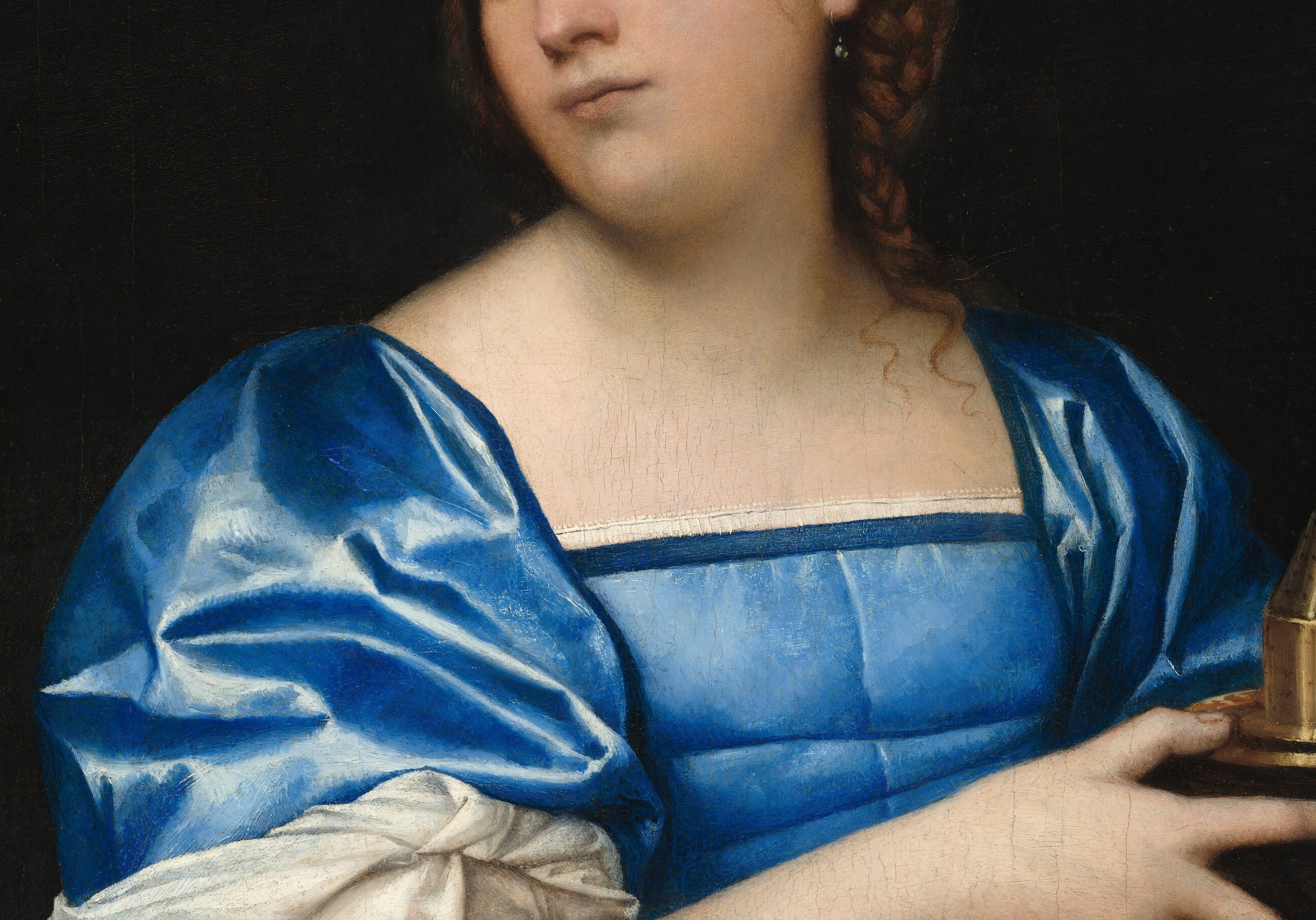 Her costly blue dress also signals her status and virtue.
