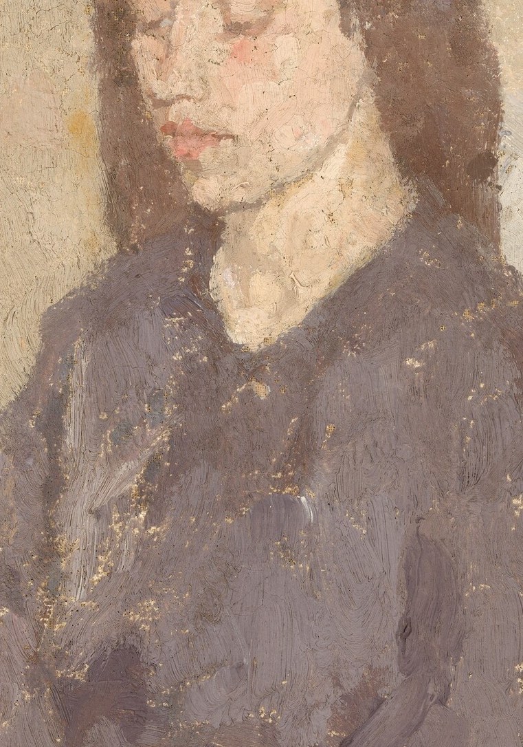 The loose, dark mass of hair frames her face and adds to the sense of quiet repose.