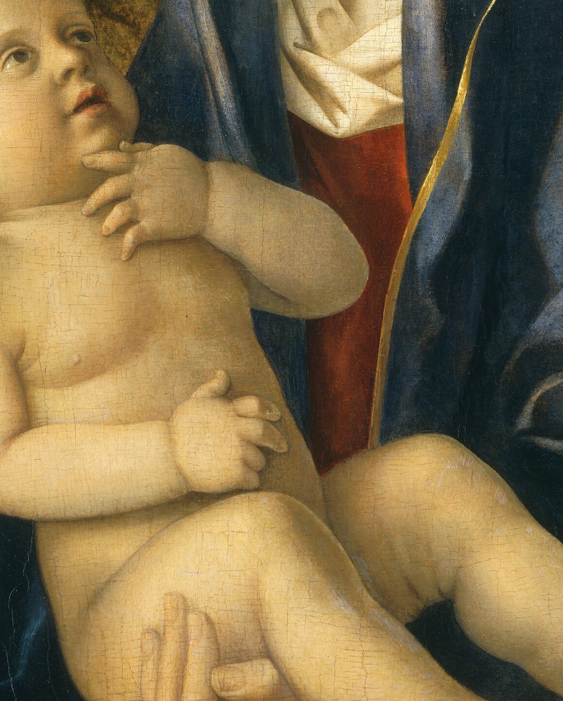 Look at the infant's bare chest.