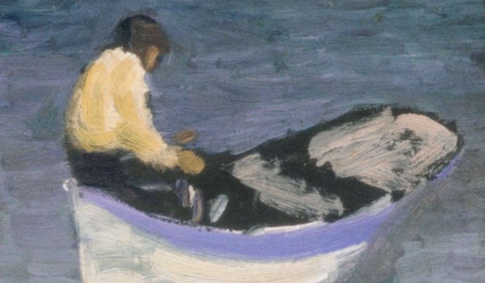 The bright yellow jacket draws the eye, contrasting with the muted tones of the water and boat.