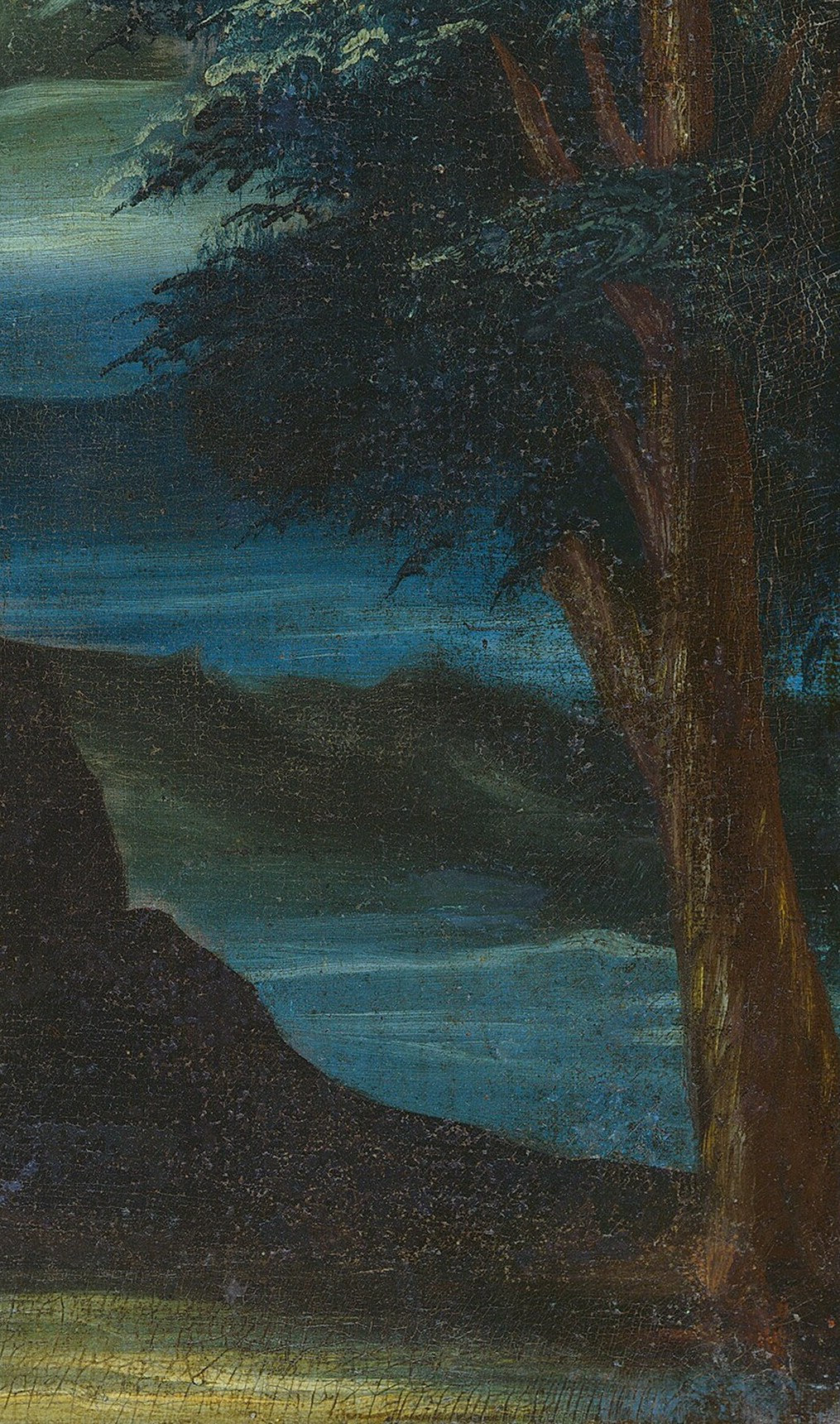 Now look past the well, into the shadow of the tree.