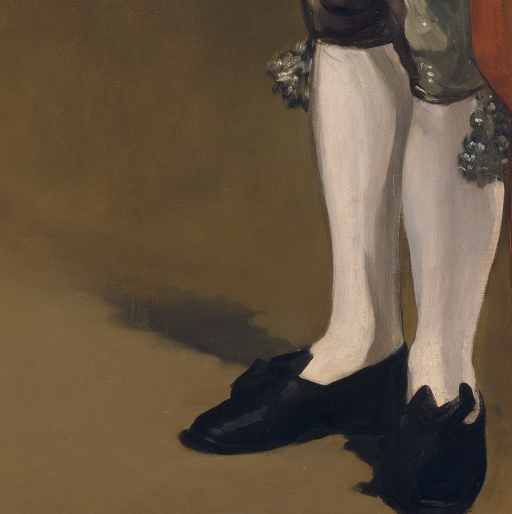 The whitest passages in the painting; they snap the eye downward and echo Spanish court-portrait conventions Manet absorbed from Velázquez.
