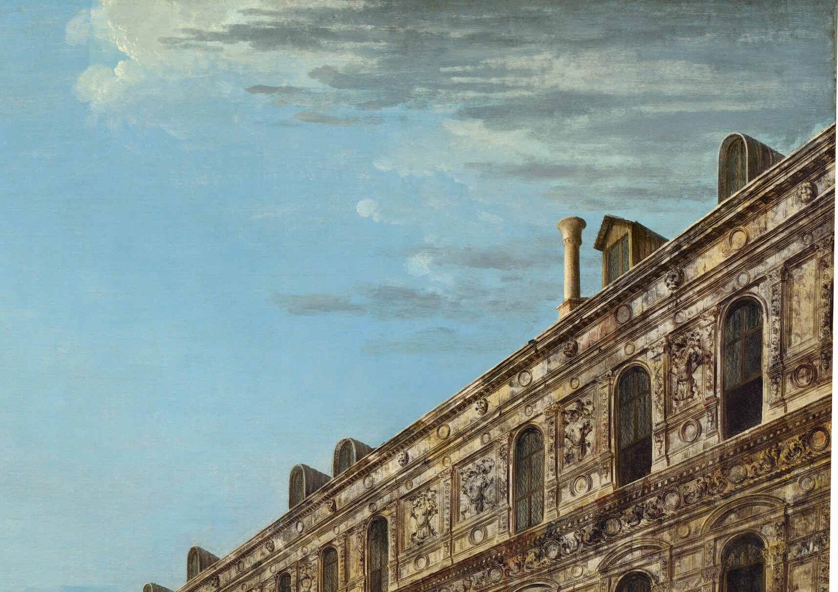 Look closely above the right loggia: the palace is watching back.