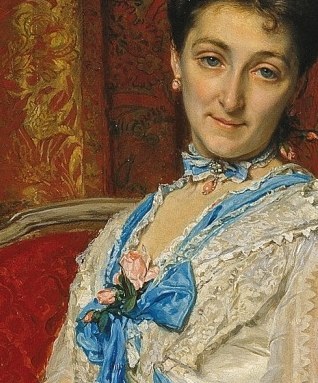 Her direct gaze and subtle expression convey a sense of quiet confidence and social poise.