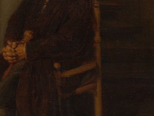 He leans on a cane. His hands never move.