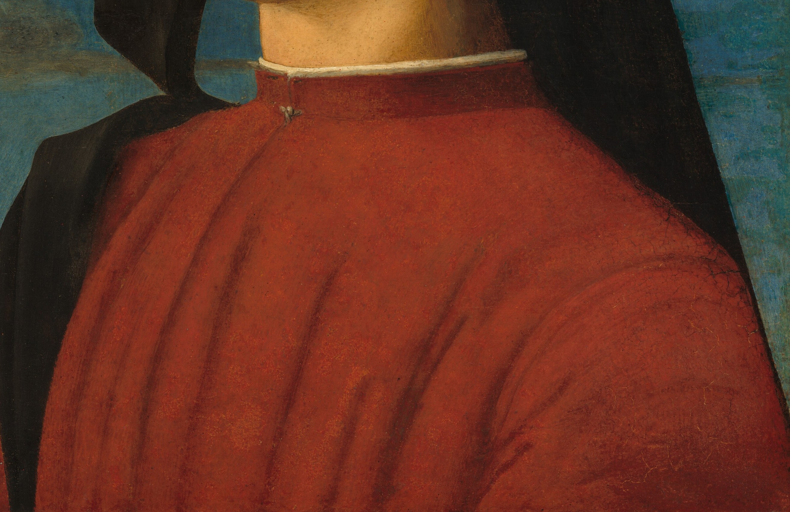 The rich, saturated red of his garment is a focal point, conveying a sense of vitality and status.