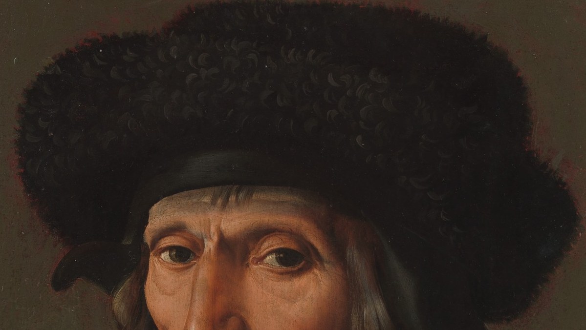 His fur hat suggests wealth and status.