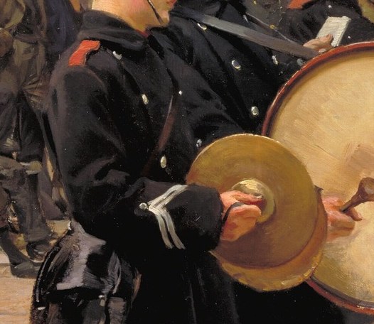 A young drummer boy, focused on the music.