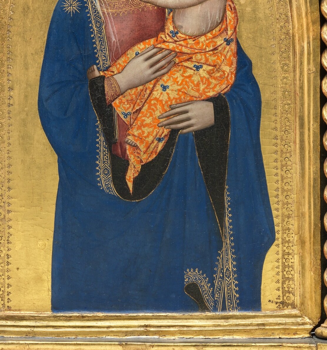 The Madonna's deep blue robe signifies her purity and heavenly status.