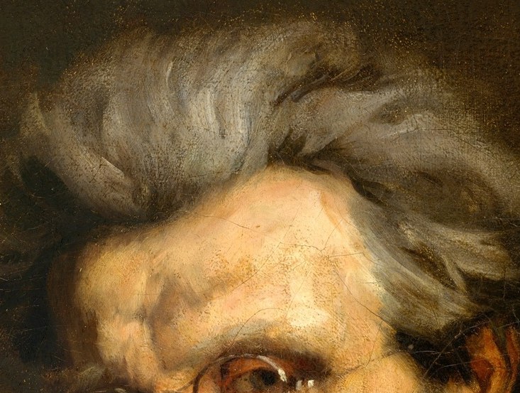 The wild white hair defies convention.