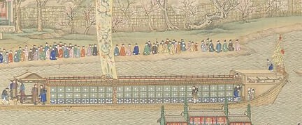 His dragon barge sits at the center of a floating city.
