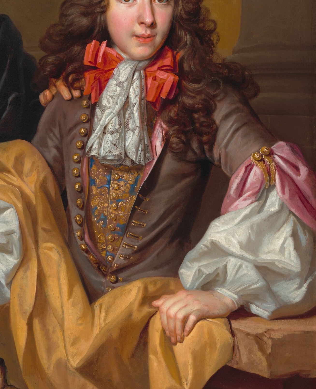 The young man's costume, in contrast, is rich and vibrant.