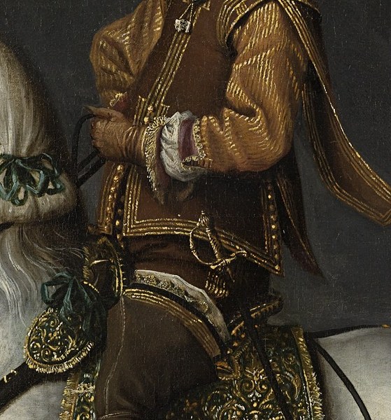 Look at the intricate gold embroidery on his jacket.