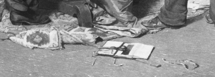 Papers are scattered on the floor.