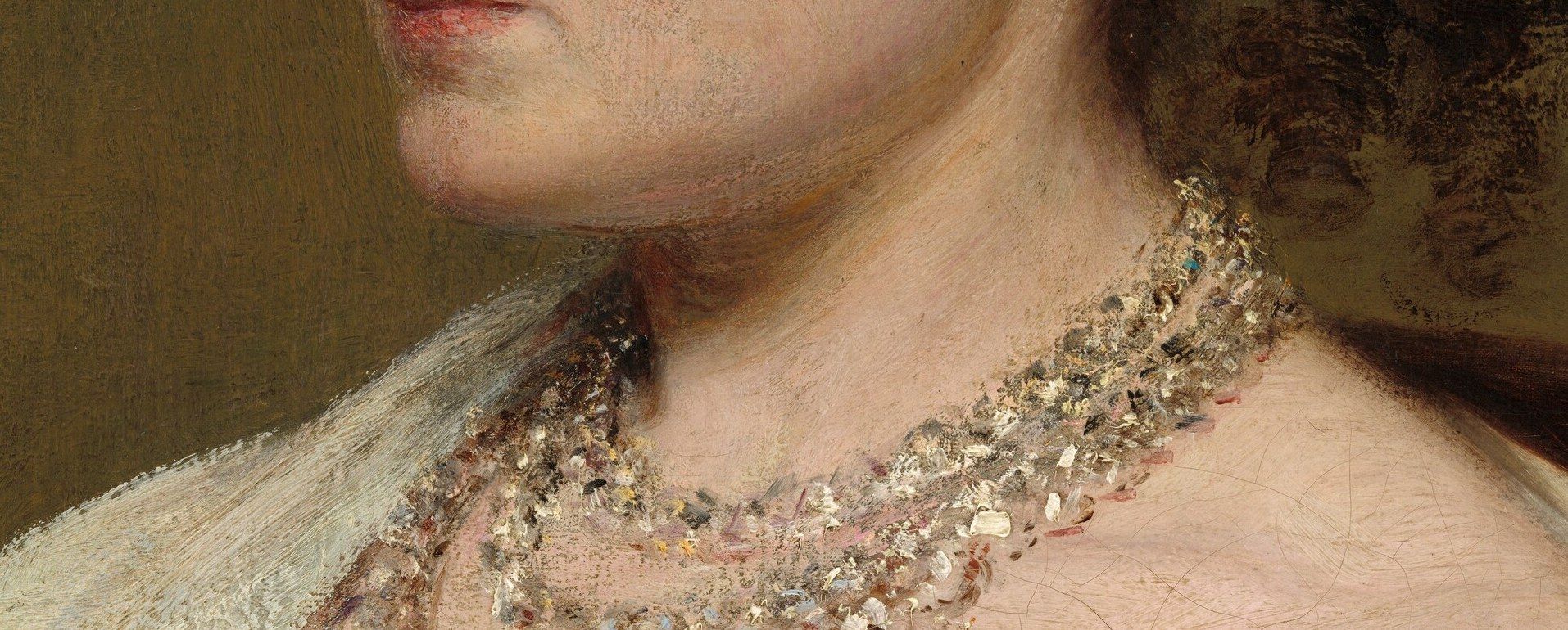 A pearl necklace marks her status.