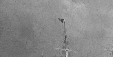 The flag in the rigging says this is an American claim on the sea.