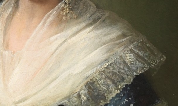Look closely at the incredibly delicate lace on her collar.