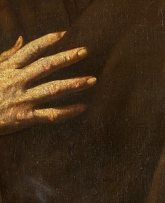 His hand rests on his chest, a sign of sincerity.